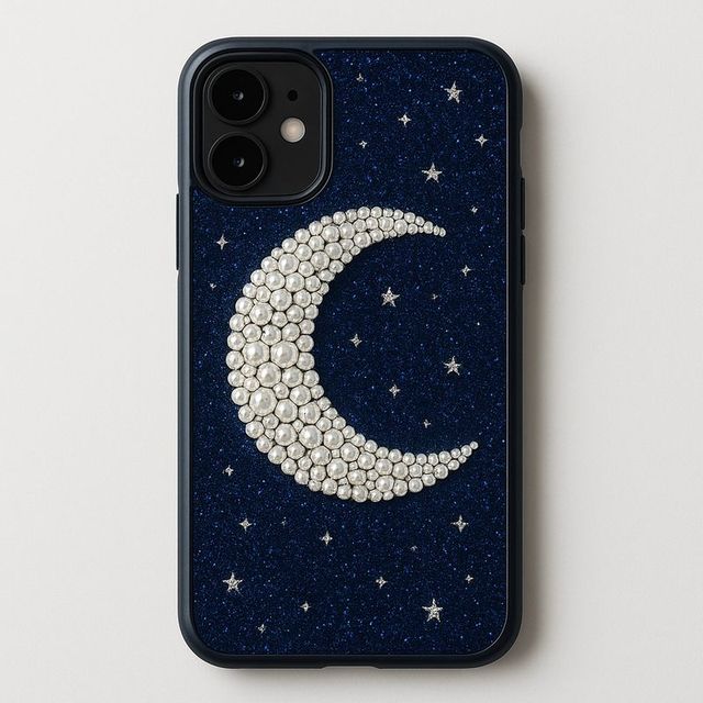 A midnight blue phone case with a pearl crescent moon and stars