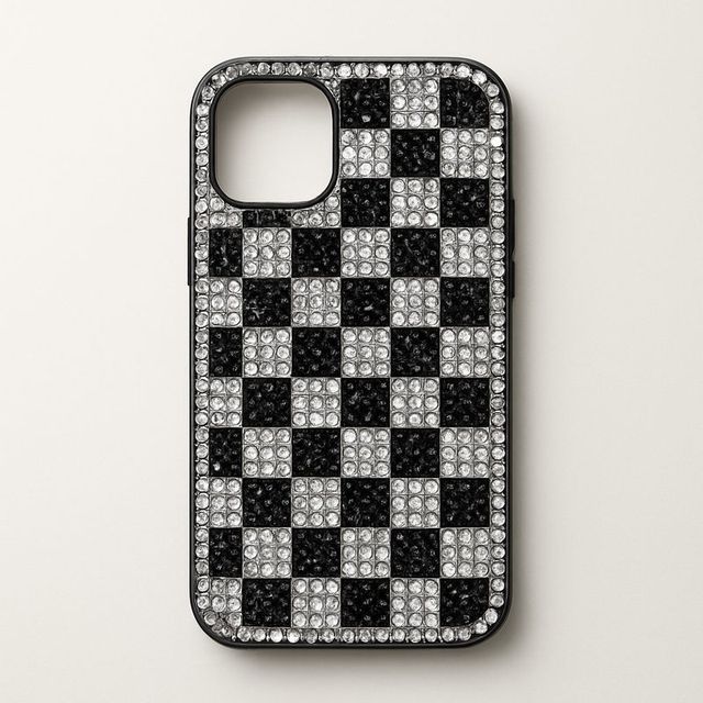 A phone case in a black and white gem checkerboard