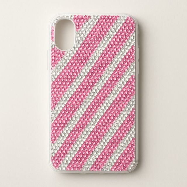 A phone case with diagonal pink and white candy stripes